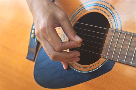 how to hold a guitar and the significance of posture in music performance